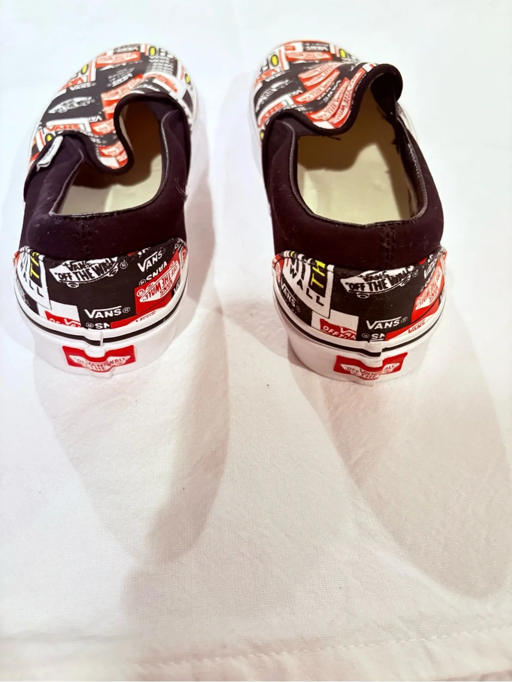 Vans Slip-On Sticker Patch Print in Black, White & Red